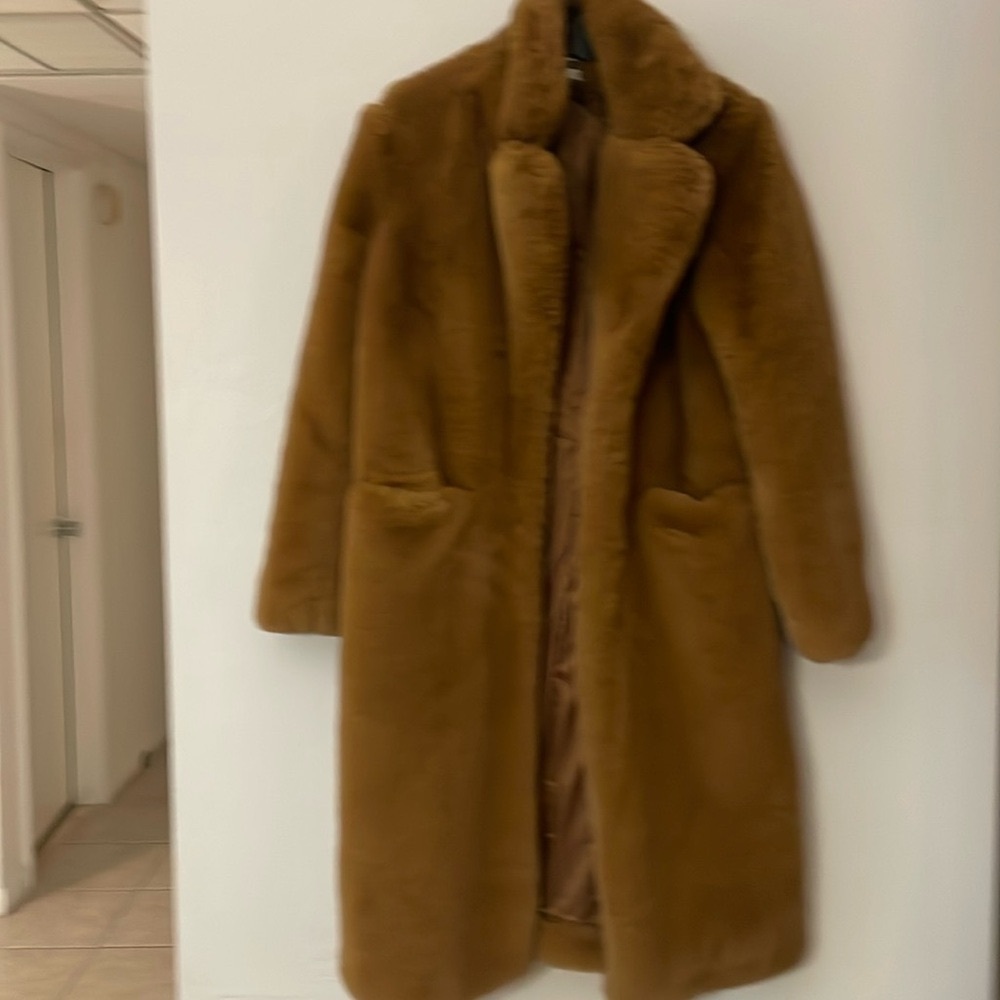 A very soft artificial fur coat, it was worn only once, very good condition.